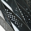 Close-up of Zhongloo black perforated HDPE geocell sheets showing drainage holes